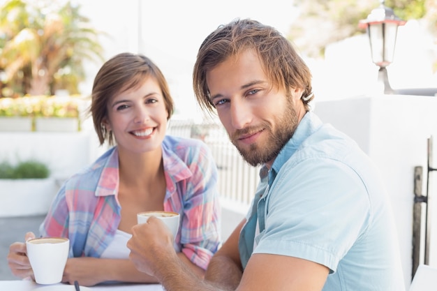 Happy couple enjoying coffee together