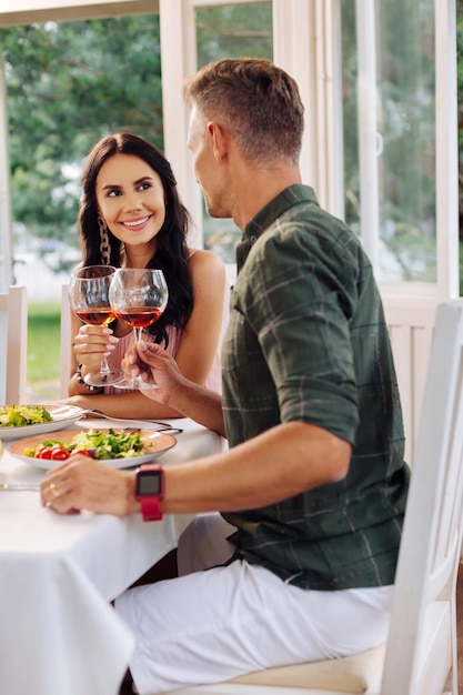 Happy couple enjoying lunch outside at the weekend