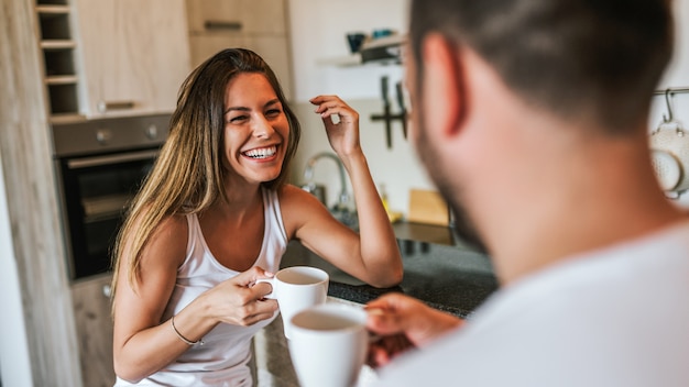 Happy couple enjoying weekend morning.