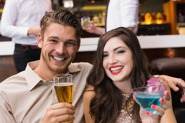 Happy couple having a drink together