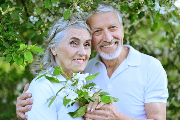 Happy couple hugging in spring park