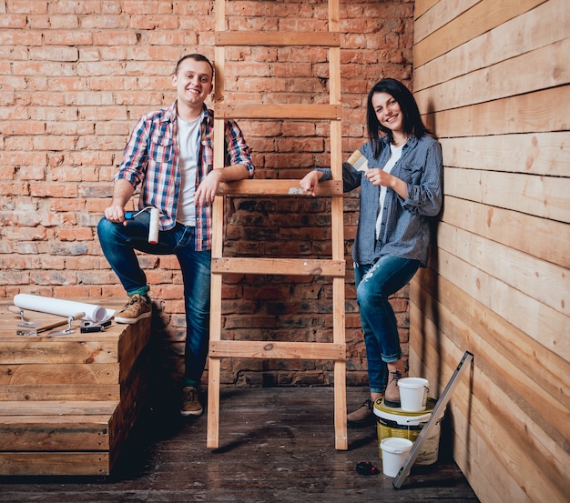 Happy couple making repairs to their home.