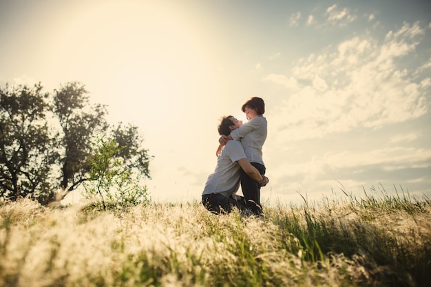 Happy couple outdoor, summertime, tinted photo