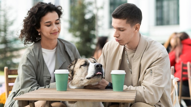 A happy couple outdoors near a cafe