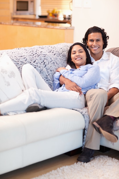 Happy couple relaxing on the couch together