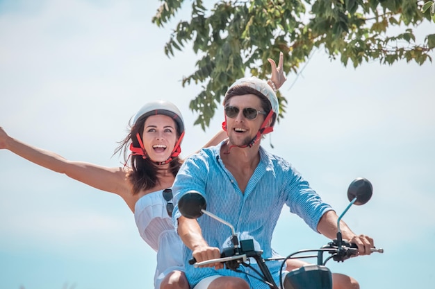 Happy couple on a scooter