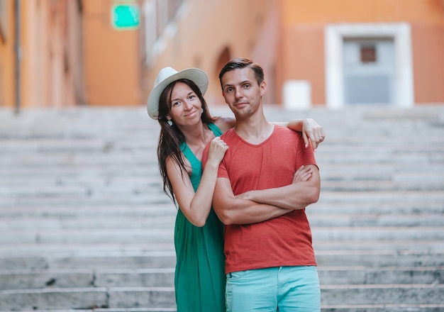 Happy couple on Steps in Rome enjoy italian holidays Happy lovers walking on the travel landmark tourist attraction