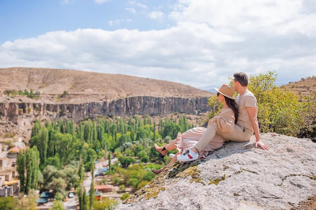 Happy couple on summer vacation in famous place cave formations