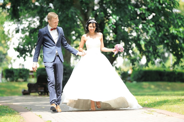 Happy couple walk through the Park. the day of the wedding.the concept of happiness