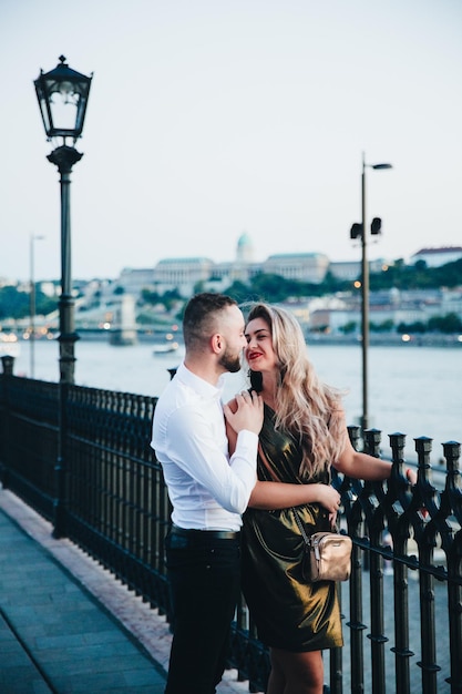 Happy couple walking in night city