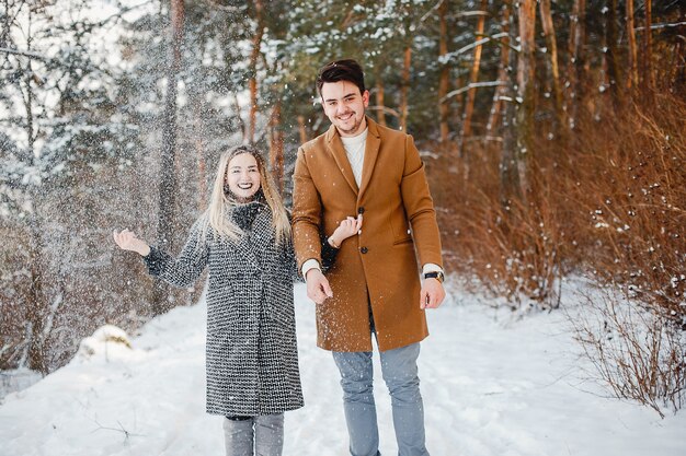 Happy couple walking through the park