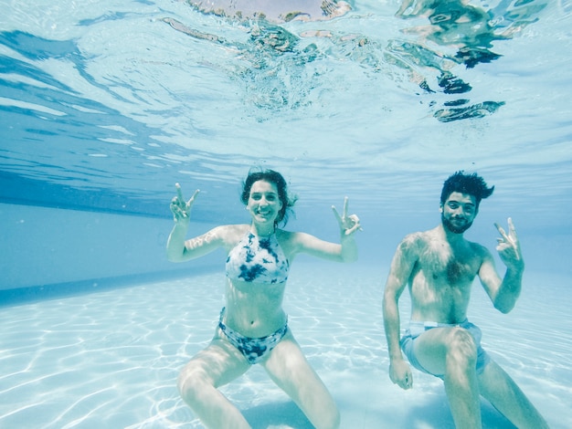 Happy couple under water