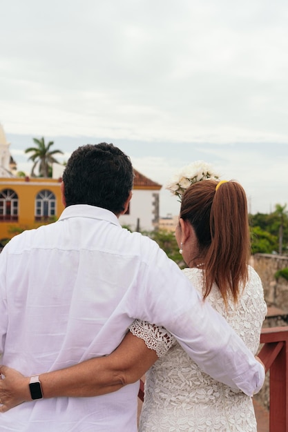 Happy Couple With Arms Outstretched