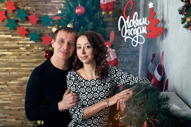 Happy couple with Christmas decorations