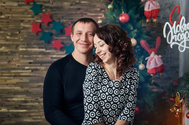 Happy couple with Christmas decorations