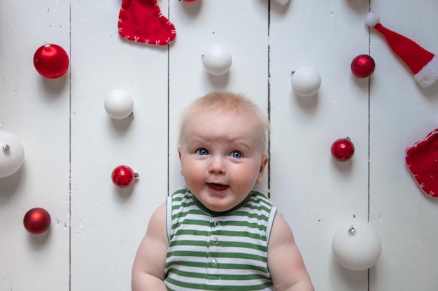 Happy cute baby celebrating their first christmas