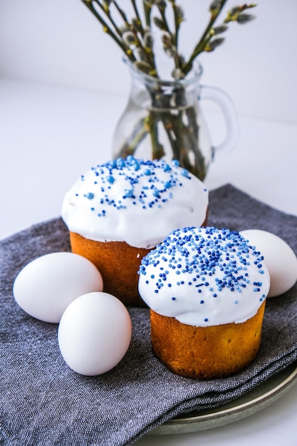 Happy Day Bright Easter Orthodox Easter holiday Traditional food Creative stylish trend Homemade easter cake and eggs Selective focus Kulich Festive easter background Minimalism