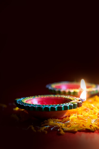 Happy Diwali - Clay Diya lamps lit during Diwali celebration. Greetings Card Design of Indian Hindu Light Festival called Diwali