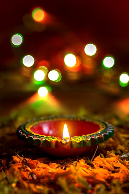 Happy Diwali - Clay Diya lamps lit during Diwali celebration. Greetings Card Design of Indian Hindu Light Festival called Diwali