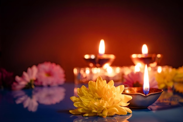 Happy Diwali Traditional symbols of Indian festival of light Burning diya oil lamps and flowers on red background