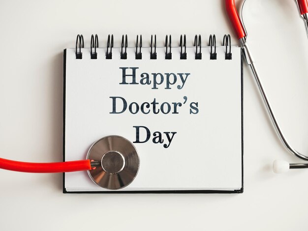 Photo happy doctors day greeting card closeup view from above nobody concept of preparation for a professional holidays congratulations for loved ones relatives friends and colleagues