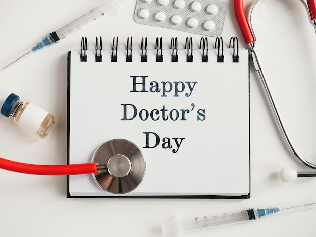 Photo happy doctors day greeting card closeup view from above nobody concept of preparation for a professional holidays congratulations for loved ones relatives friends and colleagues