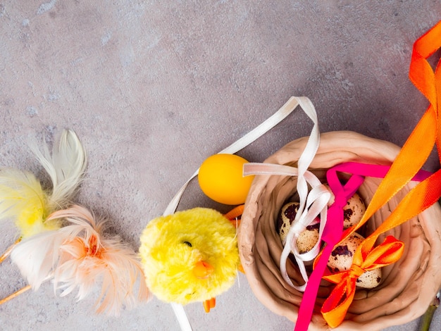 Happy easter background Easter eggs and yellow chick and clay bowl Eggs and chicken as Easter symbol Easter greetings Spring composition