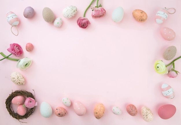 Happy Easter card template flat lay Pastel color Easter egg and flower decoration frame on pink background