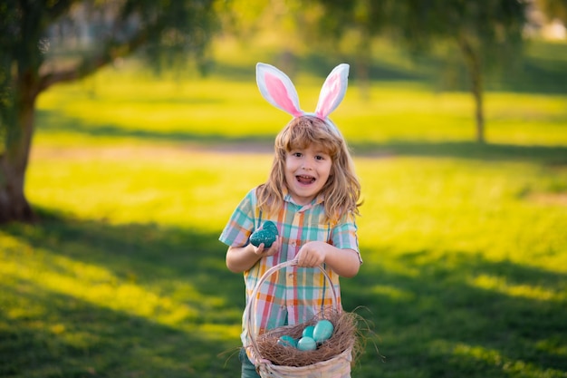 Happy easter for children kids boy hunting easter eggs child in bunny ears hunt easter eggs