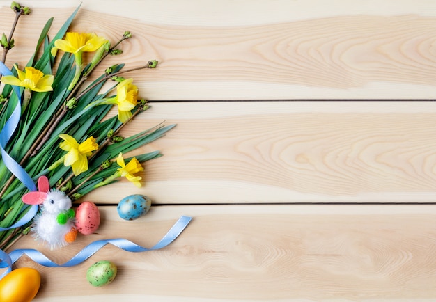 Happy Easter concept. Congratulatory easter background. Easter eggs and flowers.