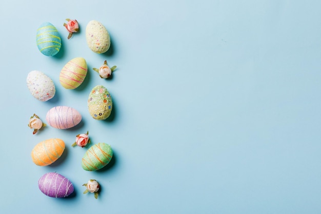 Happy Easter concept Preparation for holiday Easter eggs on colored background flat lay top view copy space banner