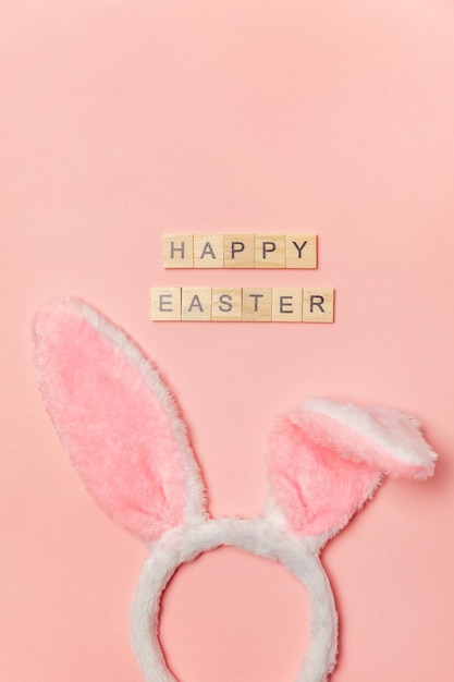 Happy easter concept preparation for holiday inscription happy easter letters decorative bunny ears