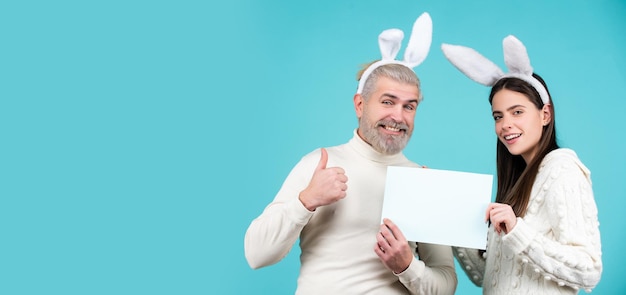 Happy easter couple funny picture of funny couple with rabbit ears isolated text background and copy