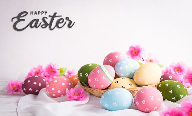 Happy easter decoration concept! Beautiful easter eggs with pink flower