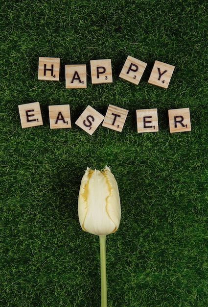 Happy Easter greeting card message with decorative flowers