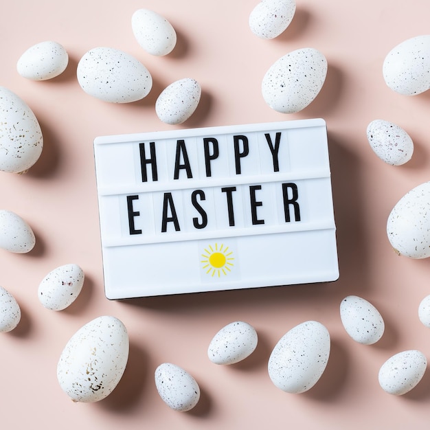 Happy Easter greeting card with eggs on pink background