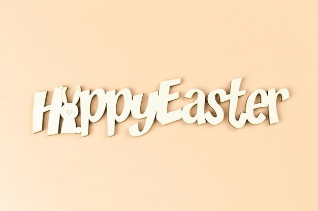 Happy easter text on a bright background, greeting concept, top view and flat lat concept photo