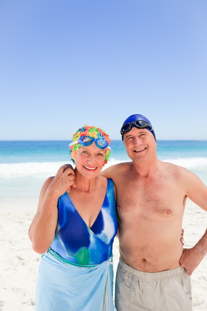 Happy elderly couple on the beach