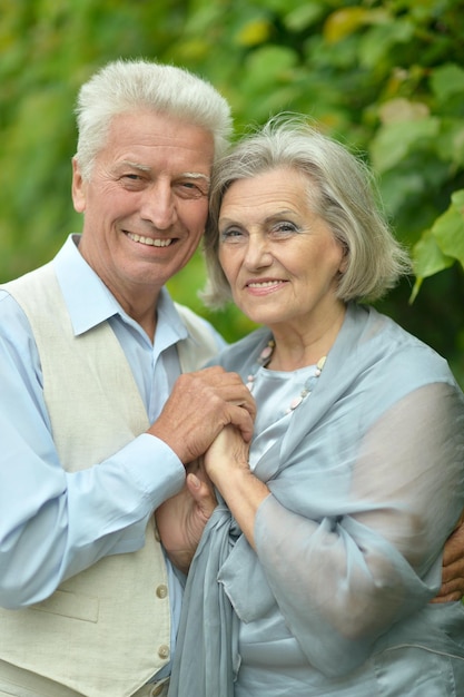 Happy elderly couple on a summer walk