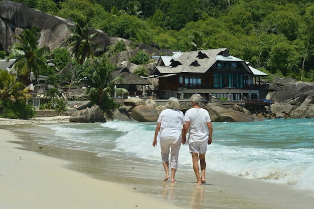 Happy elderly couple walking