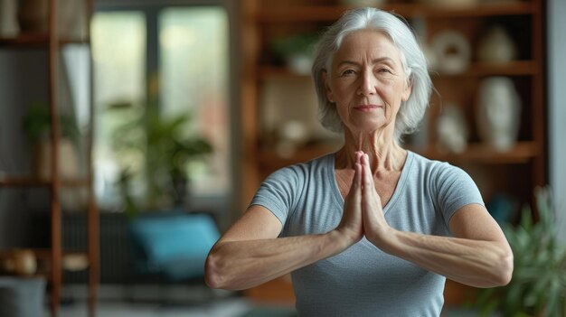 A happy elderly woman exercising her shoulders at home with green blurry backdrop with trees Generative AI