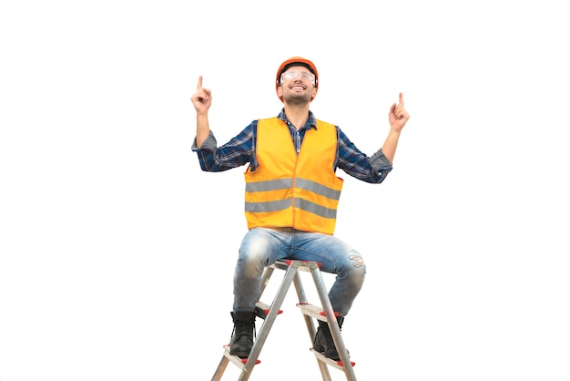 The happy engineer sitting on the ladder on the white background