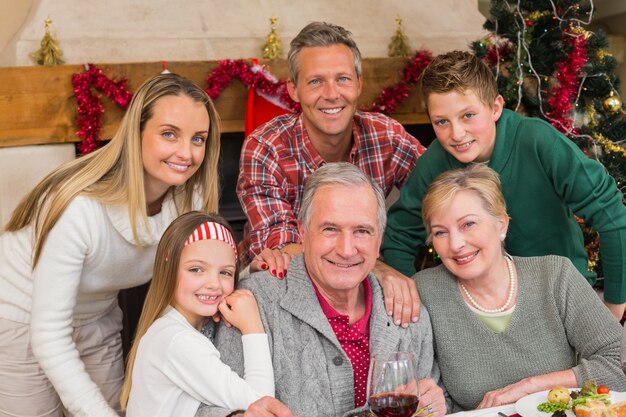 Happy extended family posing at christmas time