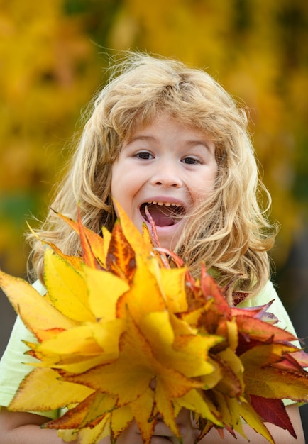 Happy fall funny autumn happiness and joyful child in autumn park