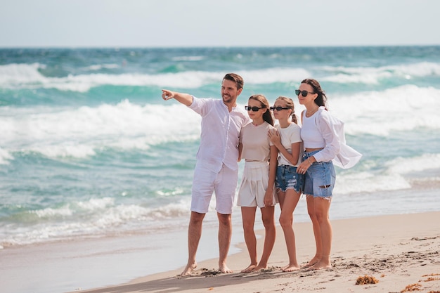 Happy family on the beach during summer vacation