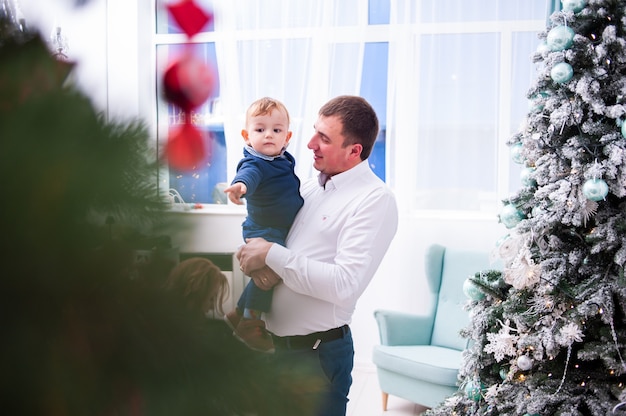 Happy family  in christmas interior before new year