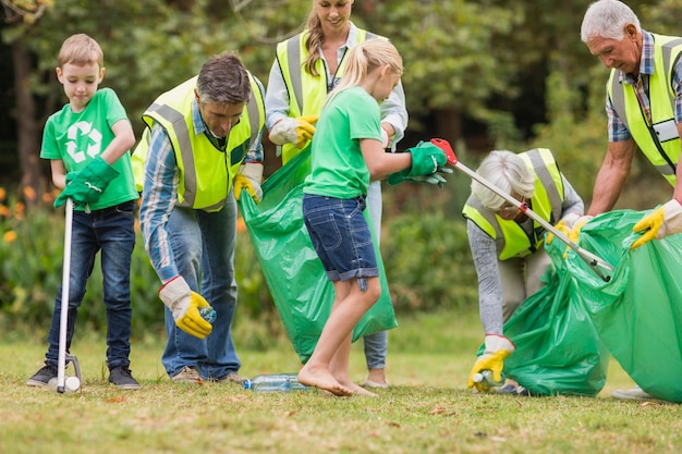 Happy family collecting rubbish 