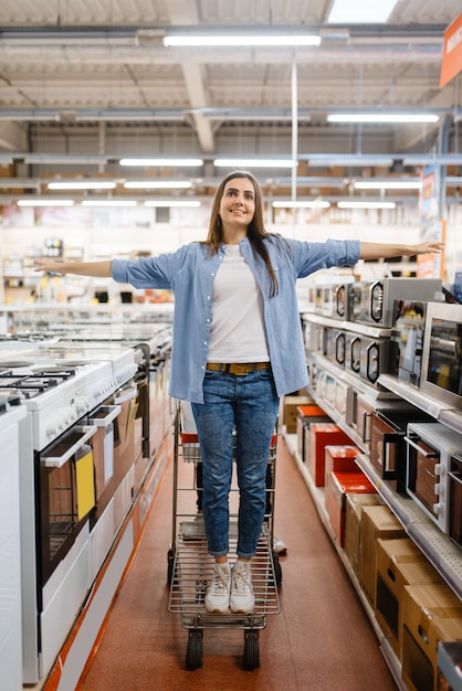 Happy family couple in electronics store