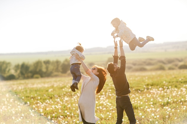 Happy family daughter hugs his dad on holiday.