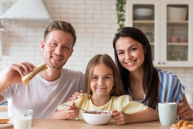 Happy family eating together